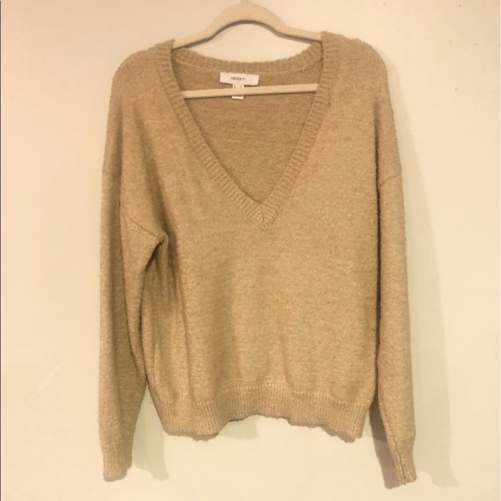 2X, tan sweater.